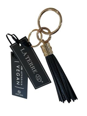 NWT•LA TERRE Tassel Keychain/ Bag Charm. Black with gold accents. Vegan leather